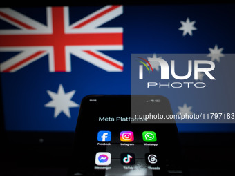 Social network logos display on a smartphone screen and the Australian flag appears on a computer screen in this photo illustration in Athen...