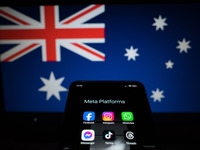 Social network logos display on a smartphone screen and the Australian flag appears on a computer screen in this photo illustration in Athen...