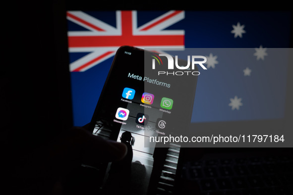 Social network logos display on a smartphone screen and the Australian flag appears on a computer screen in this photo illustration in Athen...