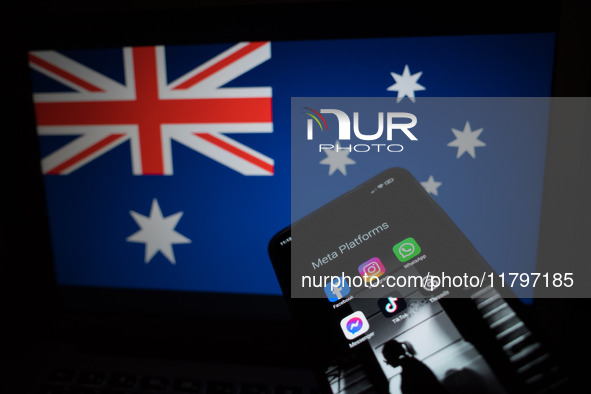 Social network logos display on a smartphone screen and the Australian flag appears on a computer screen in this photo illustration in Athen...