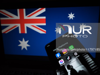 Social network logos display on a smartphone screen and the Australian flag appears on a computer screen in this photo illustration in Athen...