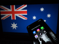 Social network logos display on a smartphone screen and the Australian flag appears on a computer screen in this photo illustration in Athen...