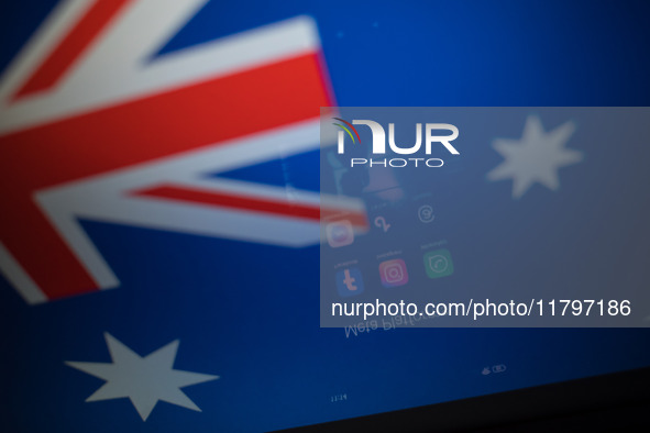 Social network logos display on a smartphone screen and the Australian flag appears on a computer screen in this photo illustration in Athen...