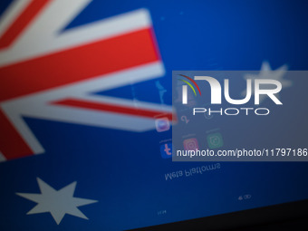 Social network logos display on a smartphone screen and the Australian flag appears on a computer screen in this photo illustration in Athen...