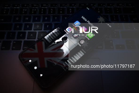 Social network logos display on a smartphone screen and the Australian flag appears on a computer screen in this photo illustration in Athen...