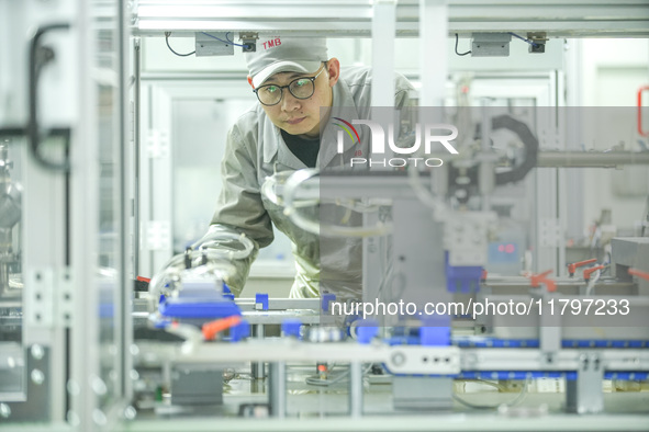 A worker produces automatic instrument valve products at a production workshop of an intelligent automatic control system company in Huzhou,...