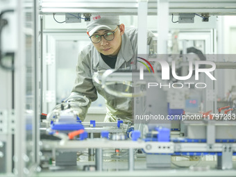 A worker produces automatic instrument valve products at a production workshop of an intelligent automatic control system company in Huzhou,...