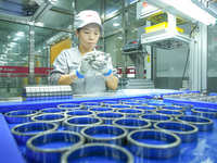 A worker produces automatic instrument valve products at a production workshop of an intelligent automatic control system company in Huzhou,...