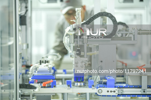 A worker produces automatic instrument valve products at a production workshop of an intelligent automatic control system company in Huzhou,...