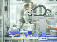 A worker produces automatic instrument valve products at a production workshop of an intelligent automatic control system company in Huzhou,...