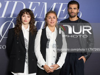 At a photocall for ''Pideme lo que Quieras'' in Madrid, Spain, on November 21, 2024, Gabriela Andrada, Megan Maxwell, and Mario Ermito appea...