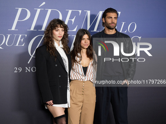 At a photocall for ''Pideme lo que Quieras'' in Madrid, Spain, on November 21, 2024, Gabriela Andrada, Lucia Alemany, and Mario Ermito are p...