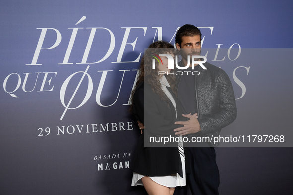 At a photocall for ''Pideme lo que Quieras'' in Madrid, Spain, on November 21, 2024, Gabriela Andrada and Mario Ermito pose. 