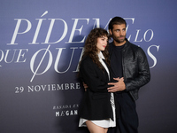 At a photocall for ''Pideme lo que Quieras'' in Madrid, Spain, on November 21, 2024, Gabriela Andrada and Mario Ermito pose. (