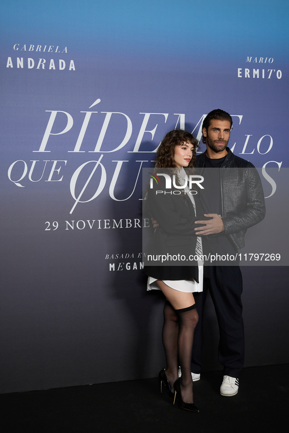 At a photocall for ''Pideme lo que Quieras'' in Madrid, Spain, on November 21, 2024, Gabriela Andrada and Mario Ermito pose. 