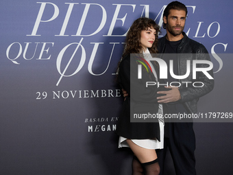 At a photocall for ''Pideme lo que Quieras'' in Madrid, Spain, on November 21, 2024, Gabriela Andrada and Mario Ermito pose. (