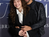 At a photocall for ''Pideme lo que Quieras'' in Madrid, Spain, on November 21, 2024, Gabriela Andrada and Mario Ermito pose. (