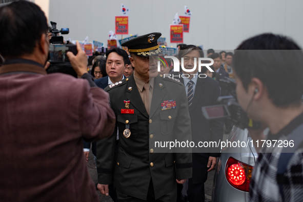 Colonel Jeong-Hoon Park (center), the former head of the Marine Corps investigation unit, arrives at the Central Regional Military Court in...