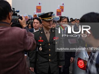 Colonel Jeong-Hoon Park (center), the former head of the Marine Corps investigation unit, arrives at the Central Regional Military Court in...