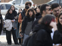 A young Iranian woman stands in line outside the Museum of Contemporary Arts while waiting to visit the ''Eye to Eye, Portraiture in Modern...