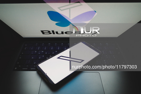 The X (former Twitter) logo appears on a smartphone screen, and a Bluesky logo appears on a computer screen in this photo illustration in At...