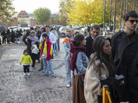 Iranian people stand in line outside the Museum of Contemporary Arts while waiting to visit the ''Eye to Eye, Portraiture in Modern and Cont...