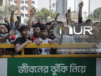 Automatic three-wheel drivers shout slogans as they block the roads and railway track after the high court orders the termination of three-w...