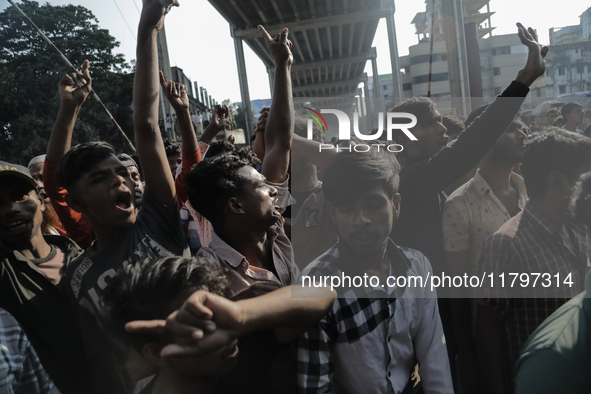 Automatic three-wheel drivers shout slogans as they block the roads and railway track after the high court orders the termination of three-w...