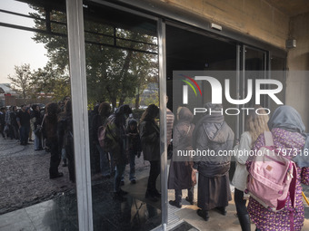 Young Iranian women stand in line outside the Museum of Contemporary Arts while waiting to visit the ''Eye to Eye, Portraiture in Modern and...