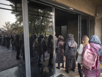 Young Iranian women stand in line outside the Museum of Contemporary Arts while waiting to visit the ''Eye to Eye, Portraiture in Modern and...