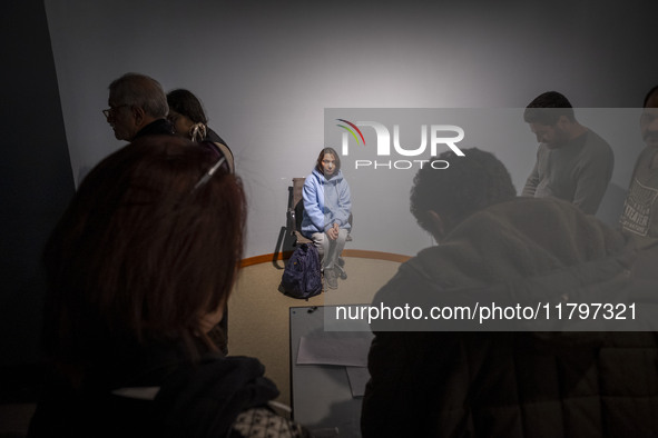 A young female art student poses for a painting while visiting the EYE to EYE, Portraiture in Modern and Contemporary Art exhibition at the...