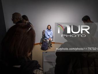 A young female art student poses for a painting while visiting the EYE to EYE, Portraiture in Modern and Contemporary Art exhibition at the...