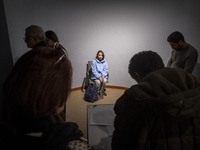 A young female art student poses for a painting while visiting the EYE to EYE, Portraiture in Modern and Contemporary Art exhibition at the...