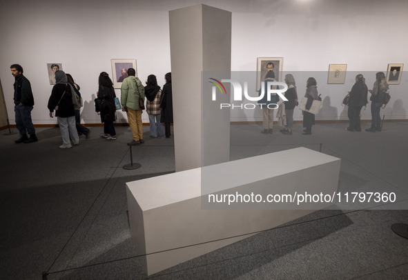 Iranian visitors explore the ''Eye to Eye, Portraiture in Modern and Contemporary Art'' exhibition at the Museum of Contemporary Arts in cen...