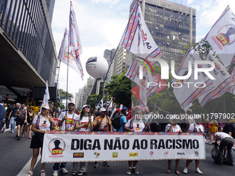 People attend a rally against racism during Black Awareness Day in Sao Paulo, Brazil, on November 20, 2024. (