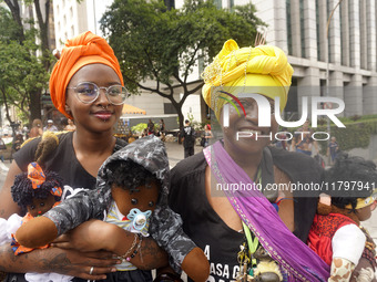 People attend a rally against racism during Black Awareness Day in Sao Paulo, Brazil, on November 20, 2024. (