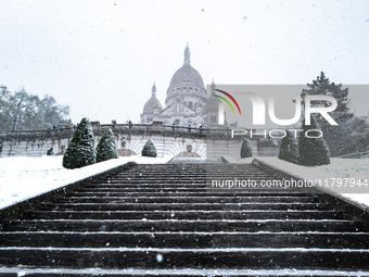 A view of the Basilique du Sacre-Coeur in heavy snowfall as Paris is under the second highest weather warning by the French national weather...