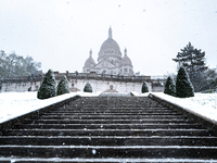 A view of the Basilique du Sacre-Coeur in heavy snowfall as Paris is under the second highest weather warning by the French national weather...