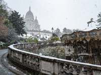 A view of the Basilique du Sacre-Coeur in heavy snowfall as Paris is under the second highest weather warning by the French national weather...