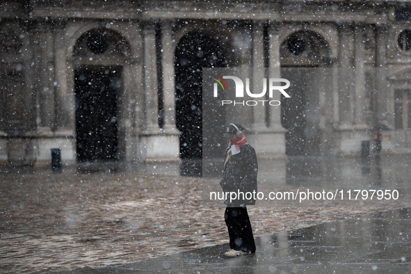 A man walks in the courtyard of the Louvre Museum in heavy snowfall as Paris is under the second highest weather warning by the French natio...