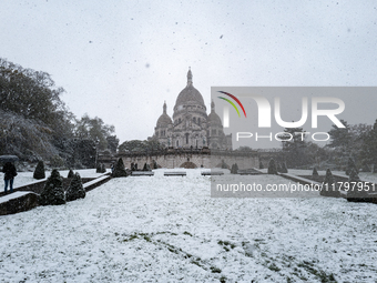 A view of the Basilique du Sacre-Coeur in heavy snowfall as Paris is under the second highest weather warning by the French national weather...