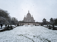 A view of the Basilique du Sacre-Coeur in heavy snowfall as Paris is under the second highest weather warning by the French national weather...