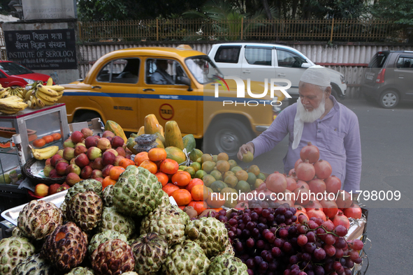 A fruit shaker waits for customers in Kolkata, India, on November 21, 2024. 