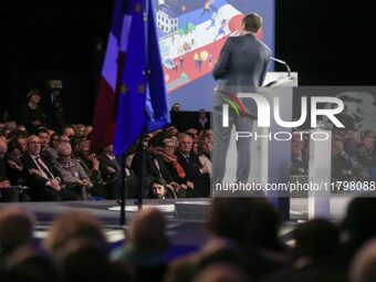 French Prime Minister Michel Barnier, surrounded by his ministers, listens to the speech of Cannes' mayor and AMF president David Lisnard du...