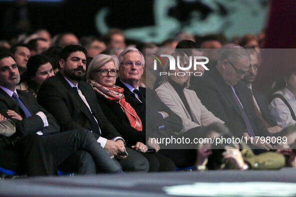 French Prime Minister Michel Barnier, surrounded by his ministers, listens to the speech of Cannes' mayor and AMF president David Lisnard du...