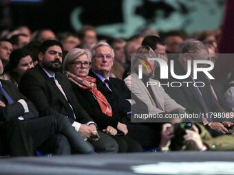 French Prime Minister Michel Barnier, surrounded by his ministers, listens to the speech of Cannes' mayor and AMF president David Lisnard du...