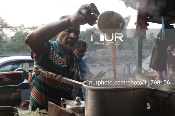 A tea seller makes tea at a street-side temporary tea stall in Kolkata, India, on November 21, 2024. 