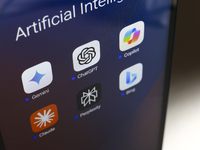 The logos of Google Gemini, ChatGPT, Microsoft Copilot, Claude by Anthropic, Perplexity, and Bing apps are displayed on the screen of a smar...