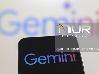 The Google Gemini logo appears on a smartphone screen and in the background on a computer screen in Reno, United States, on November 21, 202...