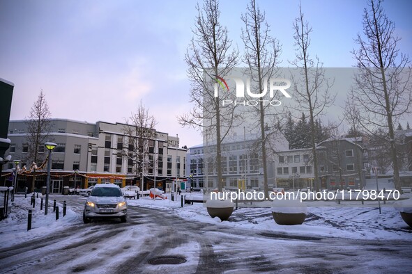 A car drives along one of the main streets in Akureyri, Iceland, on November 20, 2024. 